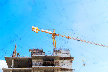 Construction site with cranes on blue skyの写真素材