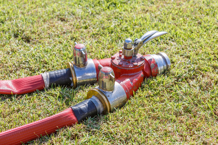 Firefighters spray water pipe