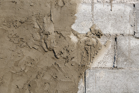 plasterer concrete on wall of house constructionの写真素材