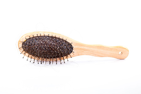 Hair Loss with comb on white backgroundの写真素材