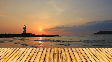 Lighthouse in the sea of thailand with bamboor floorの写真素材
