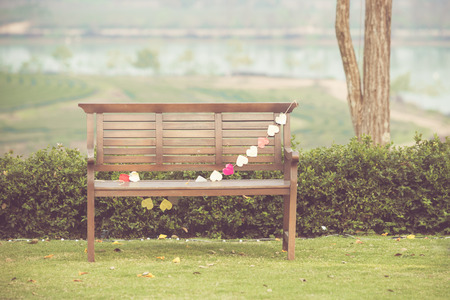 Wooden Chair in gardenの写真素材