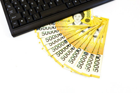 Korea money with keyboard on white backgroundの写真素材