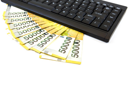 Korea money with keyboard on white backgroundの写真素材