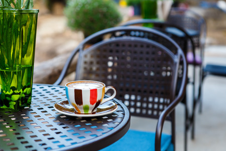 Coffee cup on table in cafeの写真素材