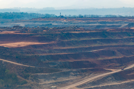 Mining dump trucks working in Lignite coalmine lampang thailandの写真素材