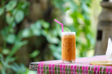 Ice tea latte on table in cafeの写真素材