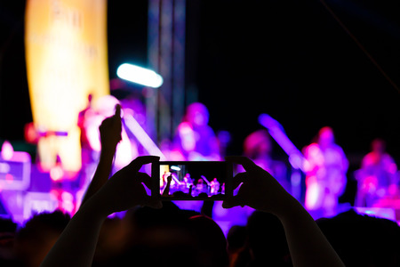 Take photo concert in front of stage