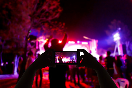 Take photo concert in front of stage