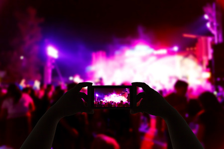 Take photo concert in front of stage