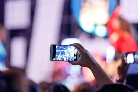 Take photo crowd in front of concert stage
