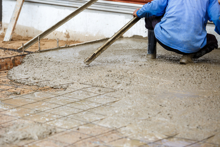 plasterer concrete worker at floor constructionの写真素材