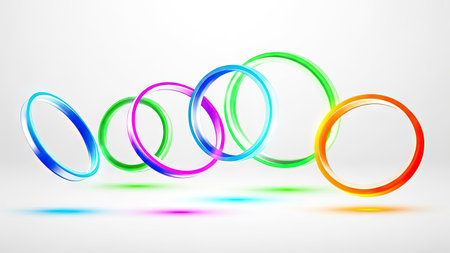 This image presents a series of vibrant, overlapping rings in various colors, set against a clean white backdrop. The composition features a dynamic arrangement with subtle shadows, creating a sense of depth and movement. It could be useful for illustrating concepts in design, marketing, or technology-related presentations.の素材