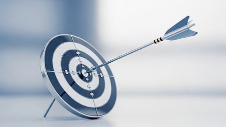 An arrow pierces a target in this image, representing achievement. The composition features a circular target with concentric rings, contrasted by the sharp arrow. The color palette is predominantly silver and white. This image is suitable for various commercial uses related to goals and strategy.の素材