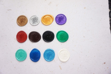 A set of multi-colored plastic buttons on a white background.の写真素材