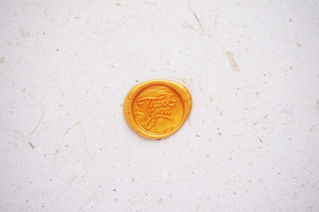 One euro coin on old paper background. Top view with copy spaceの写真素材