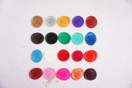 Colorful wax seal stamps on a white background, closeup of photoの写真素材