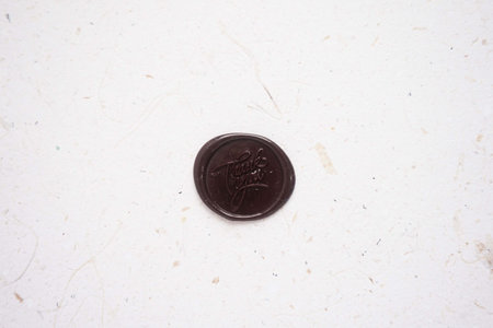 Close-up of a coin on white paper background with copy spaceの写真素材