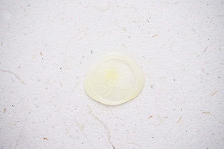 Close up of condom on white paper background. Safe sex concept.の写真素材