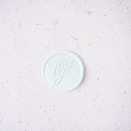 White wax seal stamp on white paper background with copy space for textの写真素材