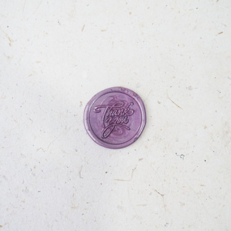 colorful thank you wax coin for vintage wedding invitation decoration on a white background. Top viewの写真素材