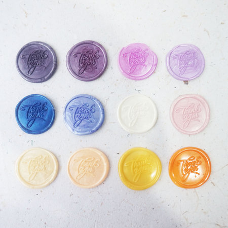 Colorful wax seal stamps on white background. Selective focus.の写真素材