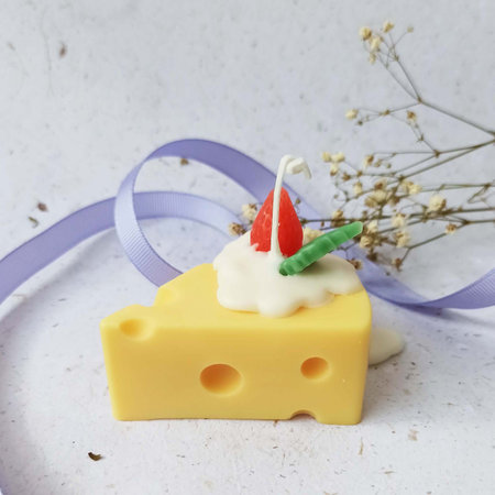 cheese and milk candle with flower on white background, sweet food.の写真素材