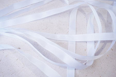 White ribbons on a light background. Place for your text.の写真素材