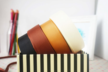 Close up of a stack of multicolor gift boxes on a shelf.の写真素材