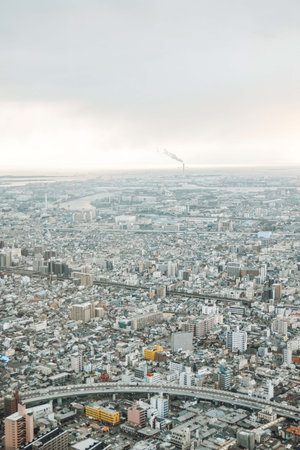 Asia Business concept for real estate and corporate construction - panoramic modern city skyline bird eye aerial view under dramatic sky and morning fog in Tokyo, Japanの写真素材