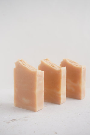 Natural handmade soap bars on white marble background. Selective focus.の写真素材