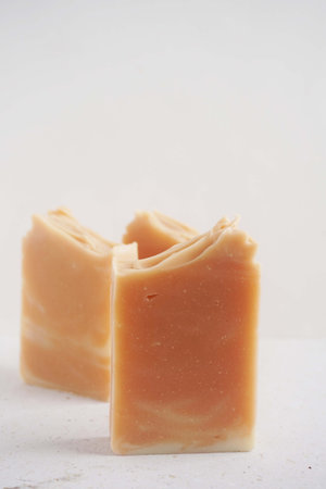 Two pieces of handmade soap on a white background. Selective focus.の写真素材
