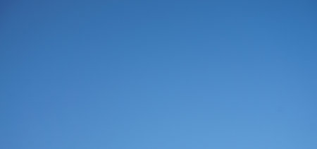 blue sky background, clear sky background, blue sky background with tiny cloudsの写真素材