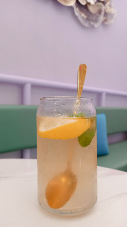 Refreshing lemonade with orange and mint in a glass.の写真素材