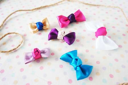 Colorful bow ties on polka dot background, close-upの写真素材