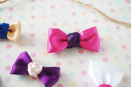 pink bow tie on white polka dot background, vintage styleの写真素材