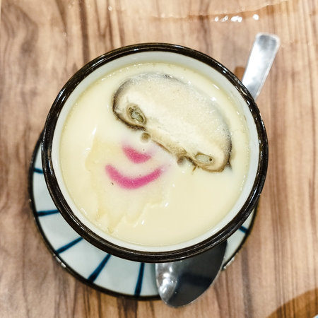 Mochi in a cup on a wooden table, top viewの写真素材