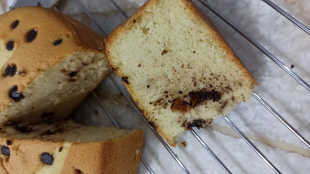 Slices of bread with chocolate chips on a wire rack.の写真素材