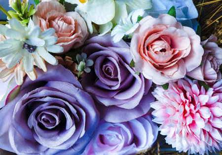 close up of colorful artificial flowers bouquet, vintage color tone.