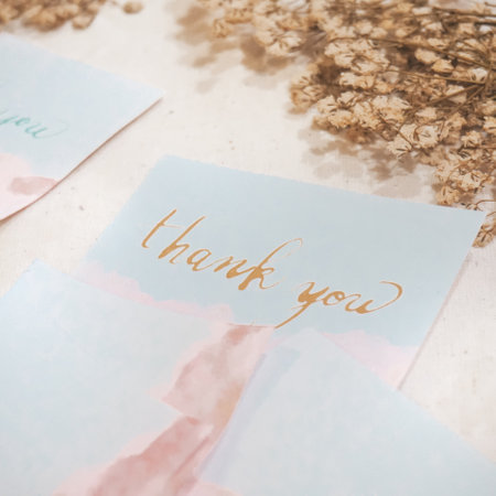 Thank you card and dried flowers on white wooden background. Vintage tonedの写真素材