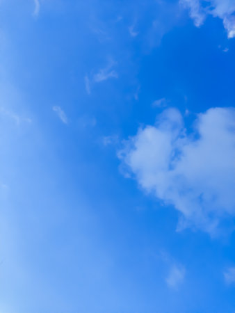 Blue sky background with tiny clouds. Abstract blue sky background with tiny cloudsの写真素材
