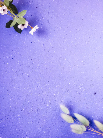 Flowers on a purple background. Flat lay, top view.の写真素材