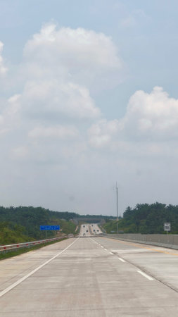 highway road with blue sky and white cloud in the morning.