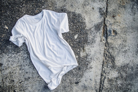 White t-shirt on the cement floor,vintage color toneの写真素材