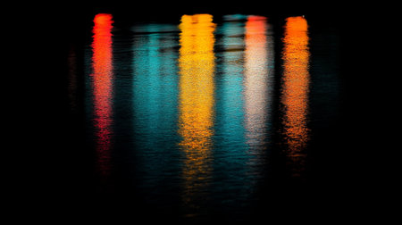 Reflection of colorful light in the water at night. Abstract background.の写真素材