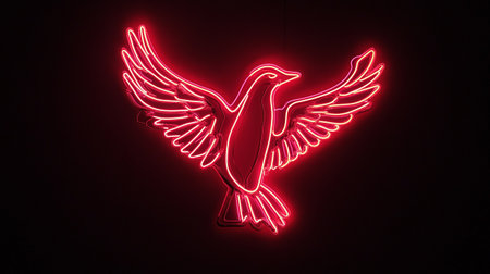 Neon sign of a bird with wings on a black background.の写真素材