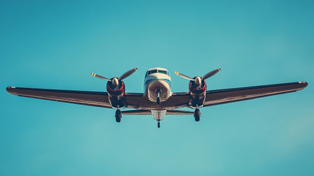 Airplane flying in the blue sky, retro toned image.の写真素材