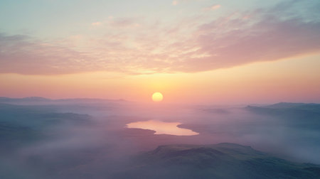 Aerial view of beautiful sunrise over the sea with fog in the morningの写真素材