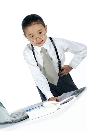 Young Korean Child Dressed up for Businessの写真素材