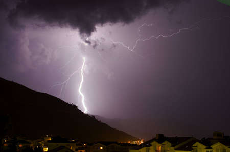 Huge Lightning bolt over hill